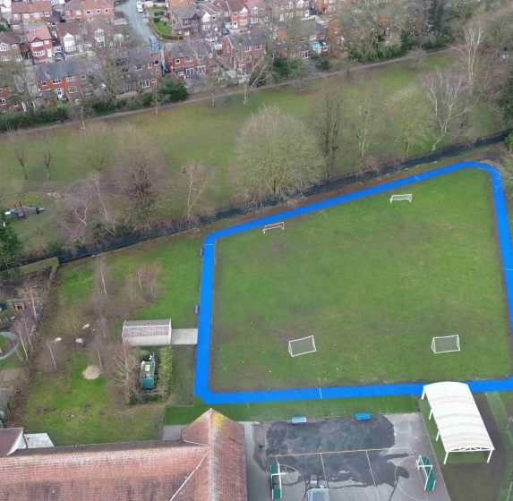 COLOURED SCHOOL TRACK IN MOSS SIDE