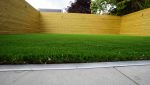 Landscaped garden with artificial grass and timber fencing in Fulwood, Preston