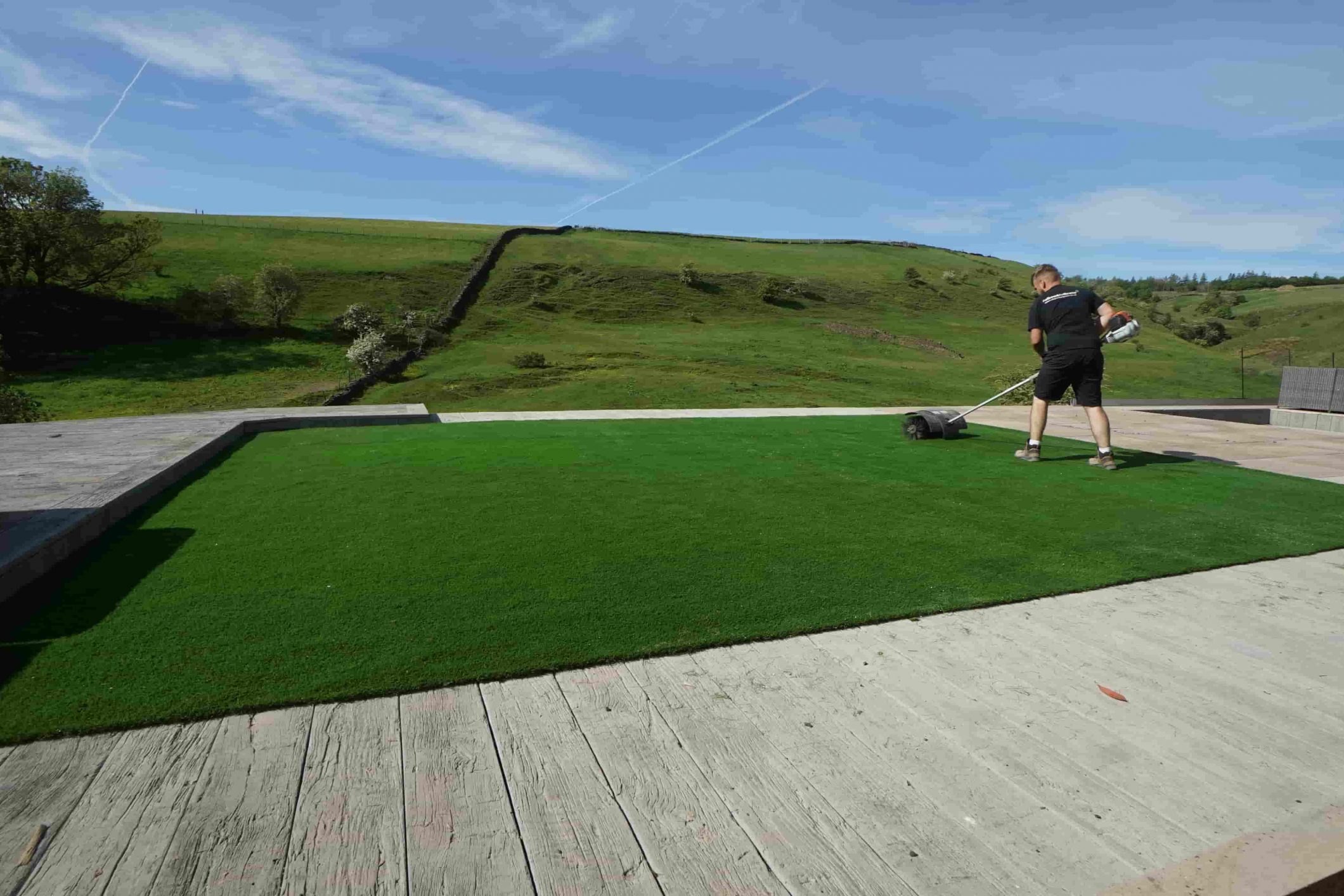 Back garden in Bacup with newly installed artificial grass for a clean, low-maintenance finish.