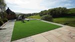 As Good As Grass installation team’s finished lawn area during a Bacup project.