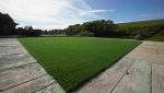 Wide view of the completed artificial grass garden installation in Bacup.