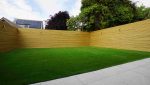 Artificial grass garden installation in Fulwood, Preston with timber fencing and porcelain patio