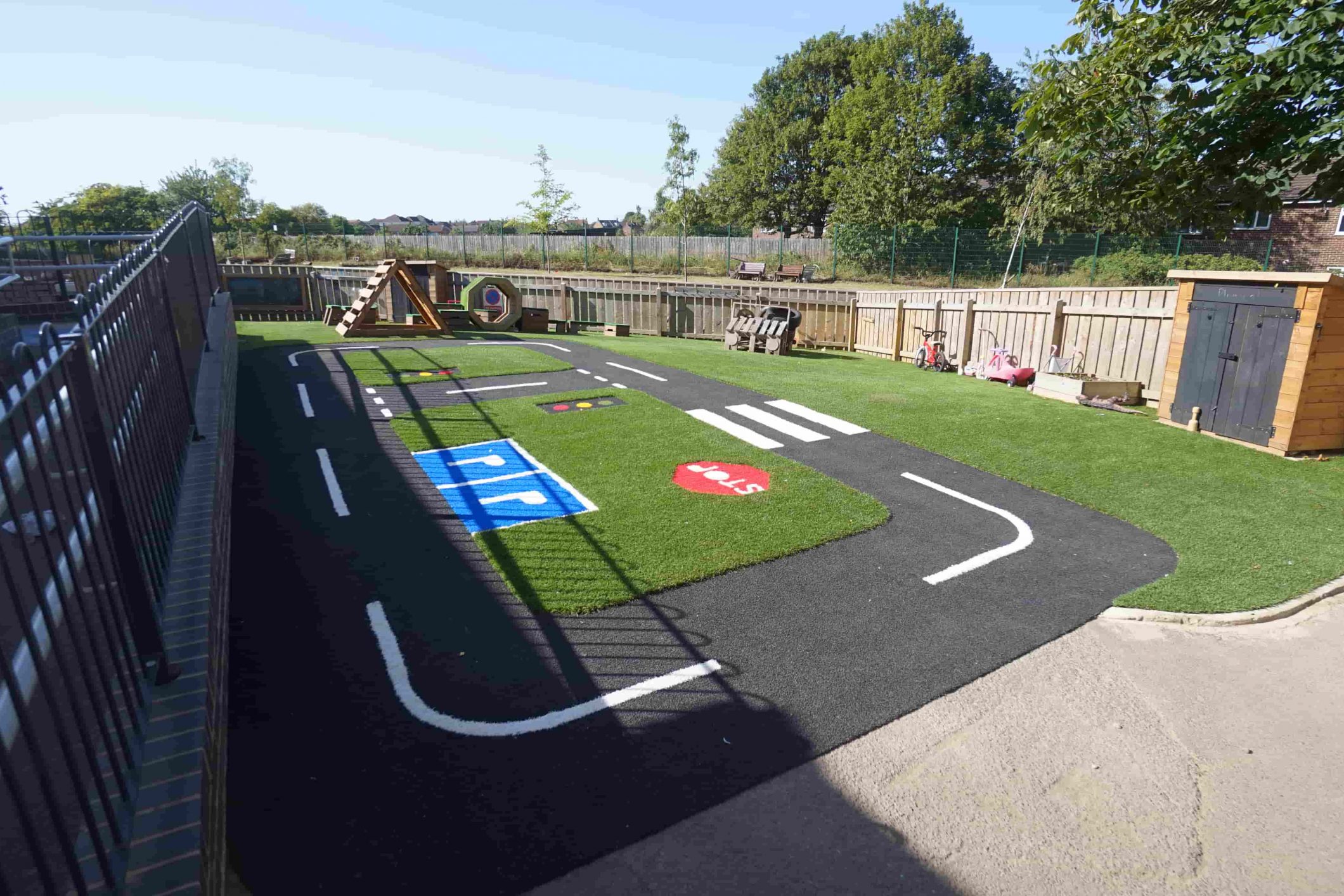 Playcare Extreme artificial grass surface with road markings and crossings