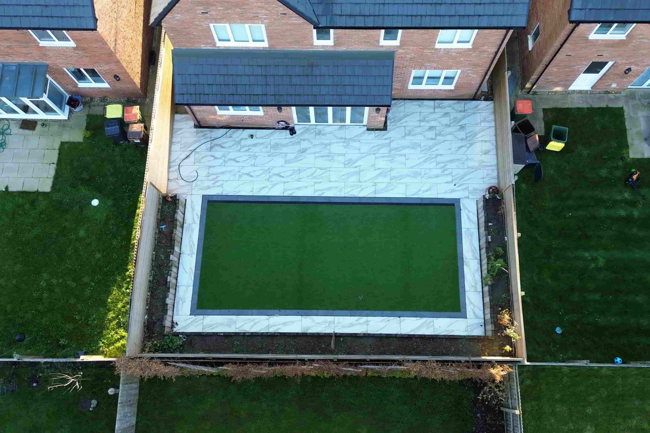 Rear garden artificial grass and porcelain patio installation in Fulwood, Preston