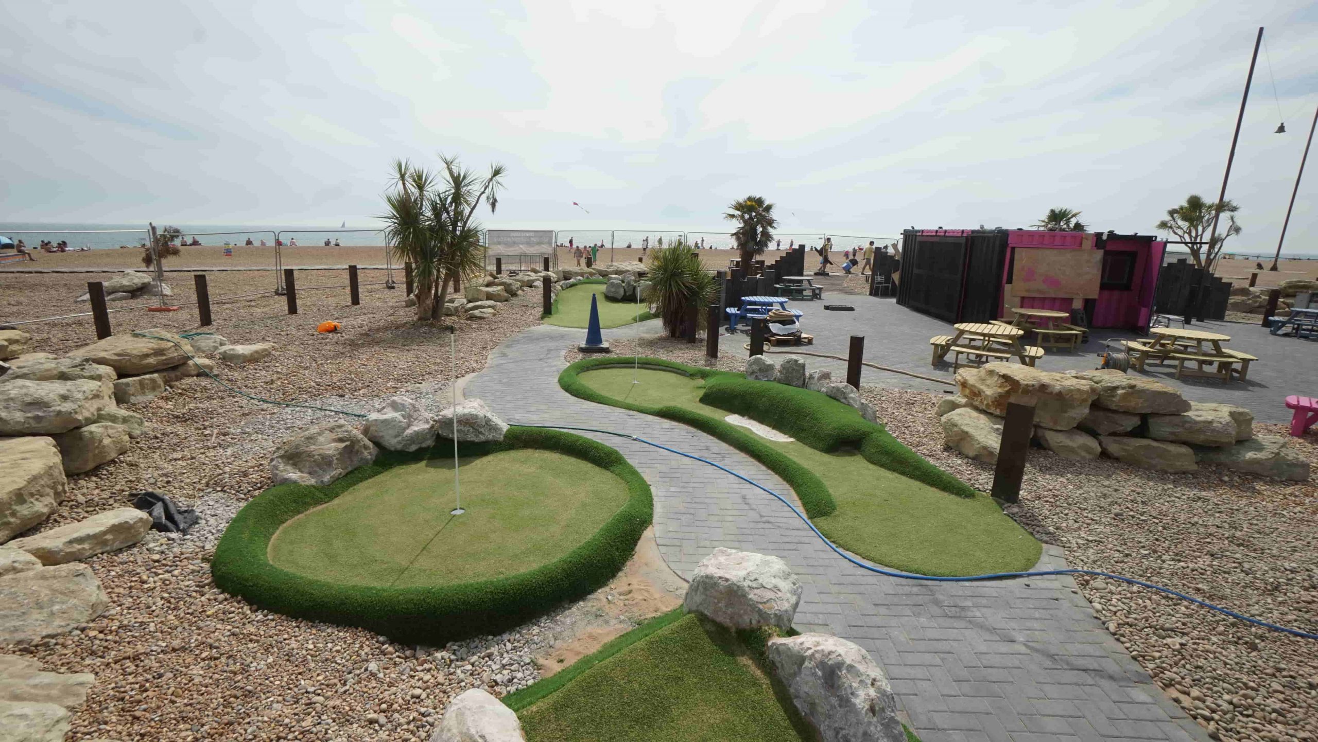 Coloured artificial turf detailing around a mini golf hole installed in Folkestone