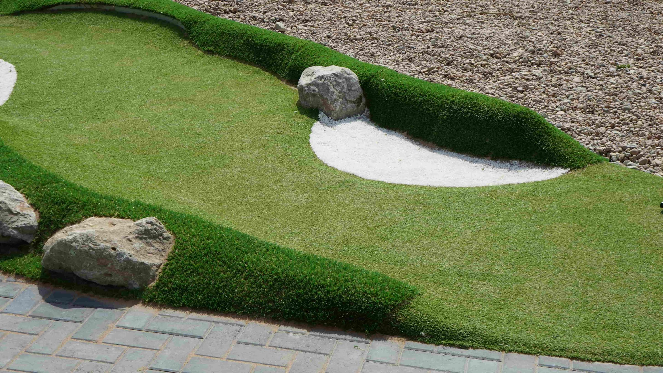 Artificial golf turf following designed slopes and contours on the Folkestone mini golf course