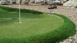 Artificial grass mini golf hole installed at Folkestone course with clean edging and smooth turf.