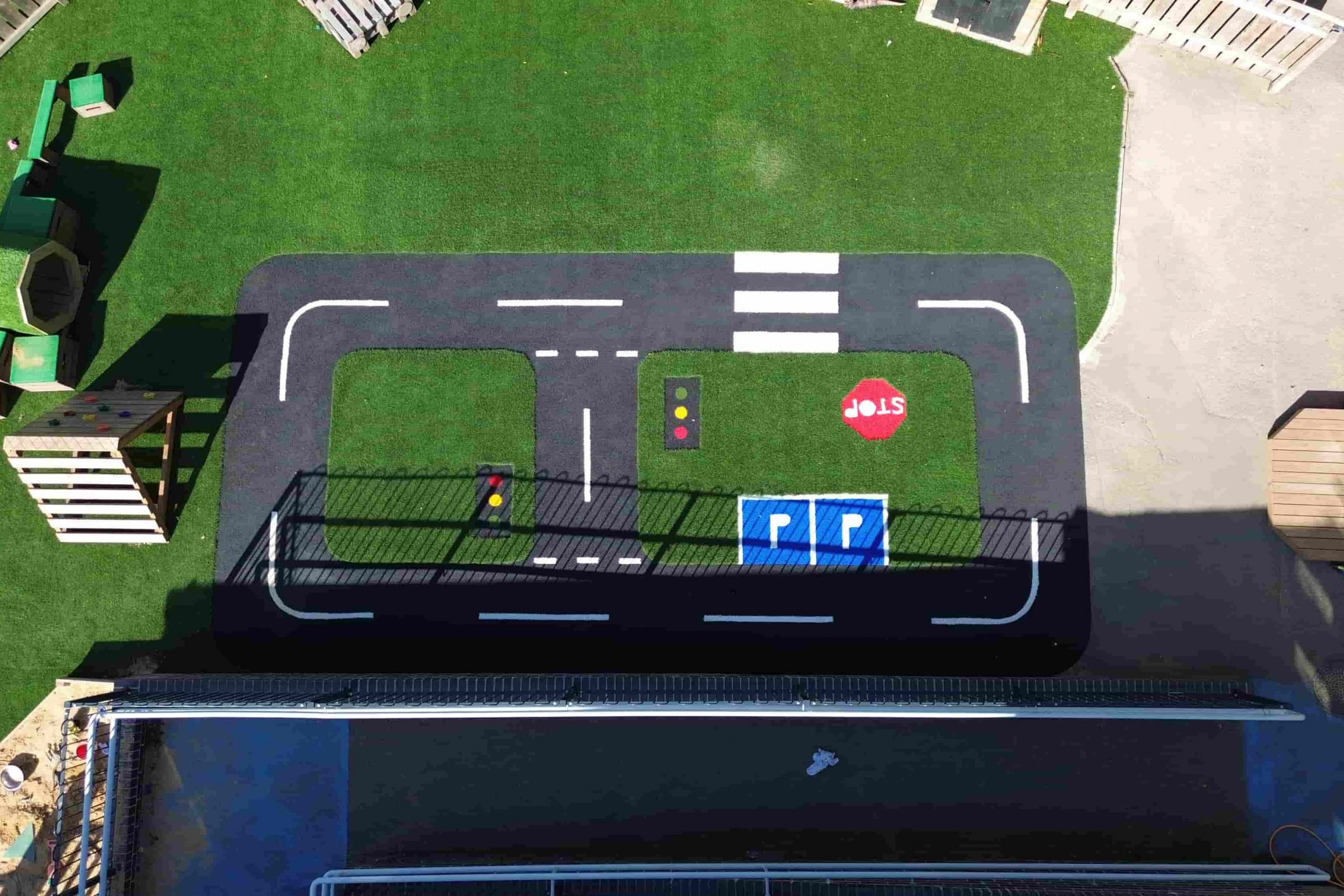 Educational artificial grass road layout used for scooters and role play