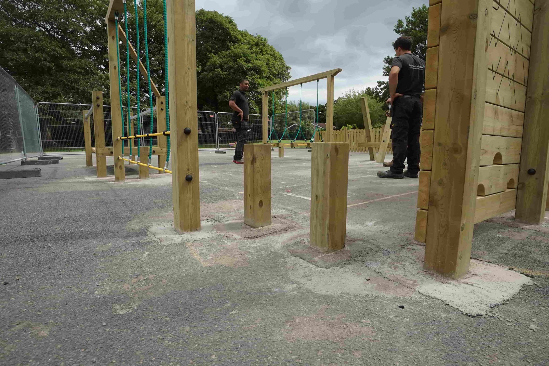 Artificial grass installation in progress at Nordon Primary School, showing secure groundwork around playground climbing frames
