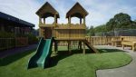 Artificial grass installed around school climbing frames at Nordon Primary School to create a safe and engaging play area